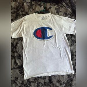 Champion white medium shirt. Small mark on front of shirt.